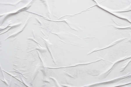 Blank white crumpled and creased paper poster texture backgroundの写真素材