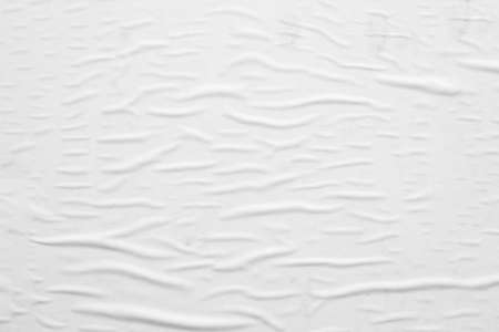 Blank white crumpled and creased paper poster texture backgroundの写真素材