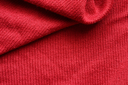 Red knitted wool texture background