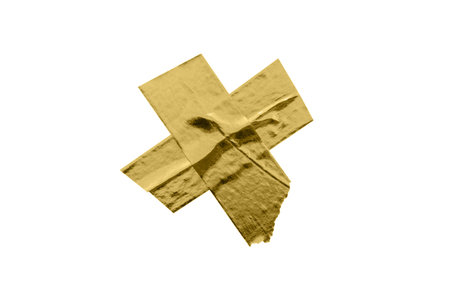 gold foil adhesive tape isolated on white backgroundの写真素材