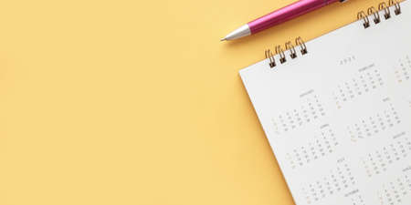 2021 calendar page on yellow color background business planning appointment meeting conceptの写真素材