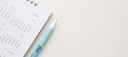 2021 calendar with pen on white background business planning appointment meeting conceptの写真素材