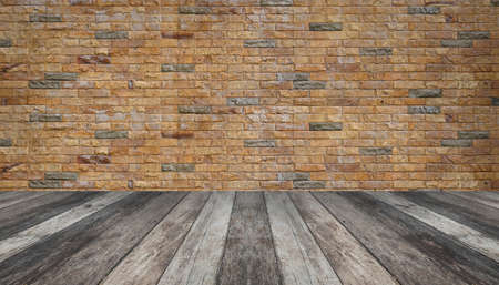 empty brick wall with wooden floor room interiorの写真素材