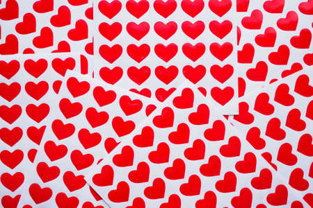 Close up red heart sticker on white paperの写真素材