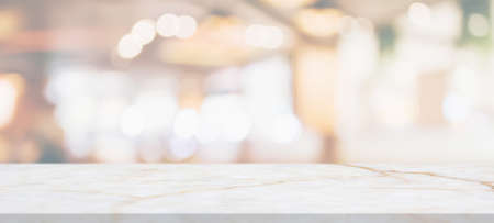 marble table top with blurred abstract cafe restaurant interior background