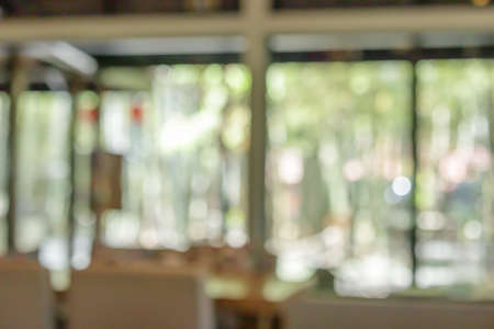 coffee shop cafe restaurant with abstract bokeh lights blur backgroundの写真素材