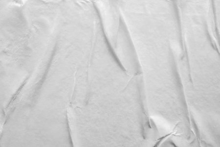 Blank white crumpled and creased paper poster texture background