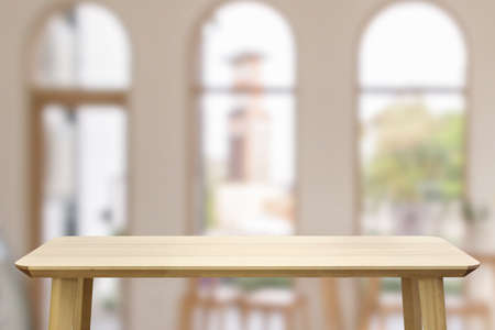 Empty wood table top with cafe restaurant interior blur background