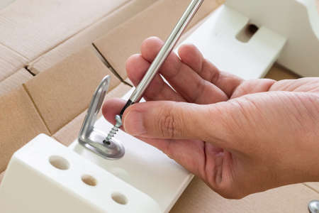 Assembly furniture using screwdriver at home