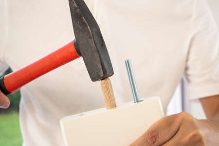 Man assembling furniture at home