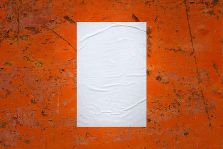 Blank white wheatpaste glued paper poster mockup on old metal wall