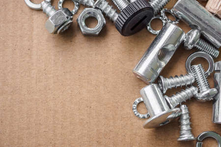 Assembly furniture tool kit with screw dowel wrench and bolt on cardboard paper texture