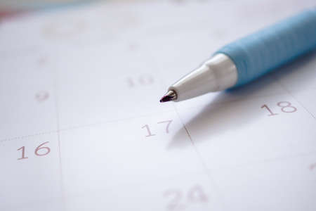 calendar page with pen close up background business planning appointment meeting concept