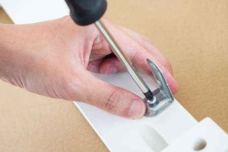 Assembly furniture using screwdriver at home