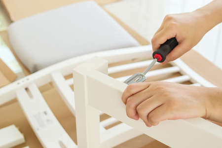 Assembly furniture using screwdriver at home