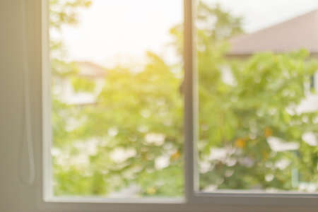 Abstract blur window interior with green garden view backgroundの写真素材