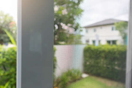 mosquito net wire screen on house window protection against insectの写真素材