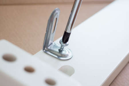 Assembly furniture using screwdriver at home