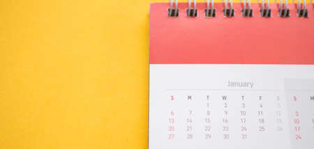 calendar page on yellow background business planning appointment meeting conceptの写真素材