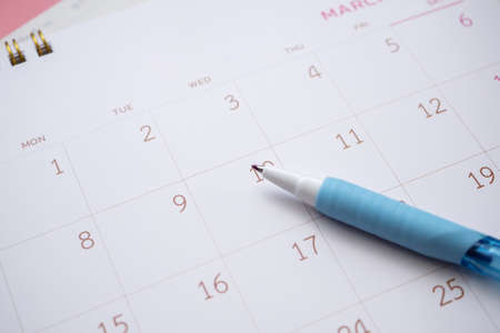 calendar page with pen close up background business planning appointment meeting conceptの写真素材