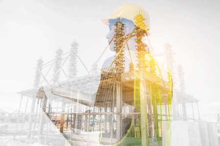 Double exposure image of professional engineer in protective helmet and blueprints paper at the house building construction siteの写真素材