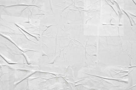 Blank white crumpled and creased paper poster textureの写真素材