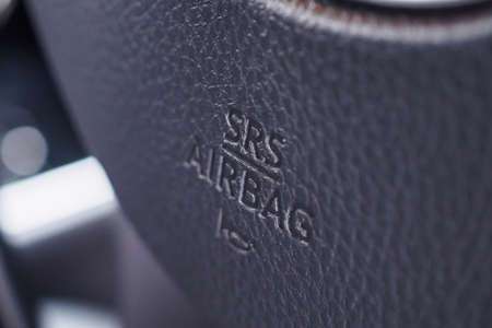 Safety airbag sign on car steering wheel with horn icon