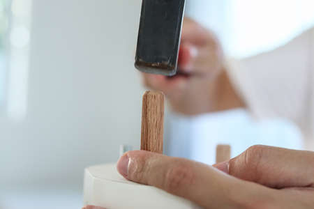 Man assembling furniture at home