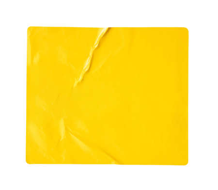 Blank yellow paper sticker label isolated on white backgroundの写真素材