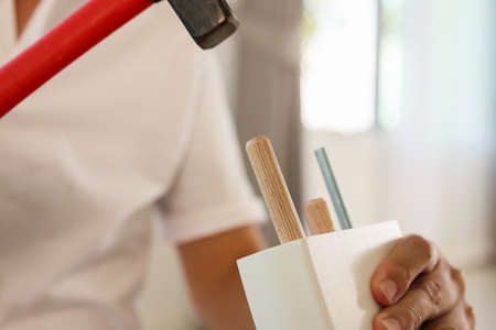 Man assembling furniture at home
