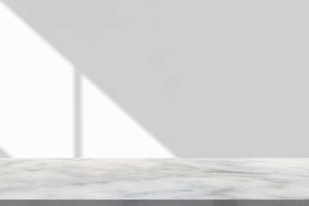 Marble table with window shadow drop on white wall background for mockup product display