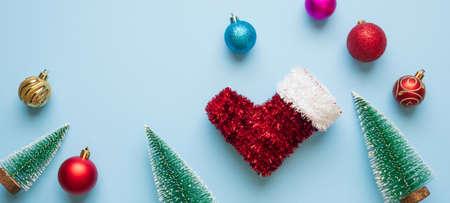 Christmas new year background pine tree ball bauble on blue pastel backgroundの写真素材