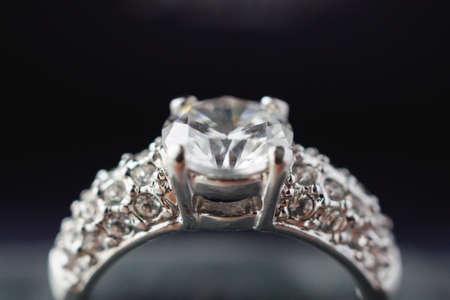 Diamond ring in jewelry gift box close up background