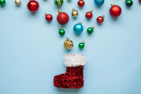 Christmas new year background ball bauble and boot on blue pastel background