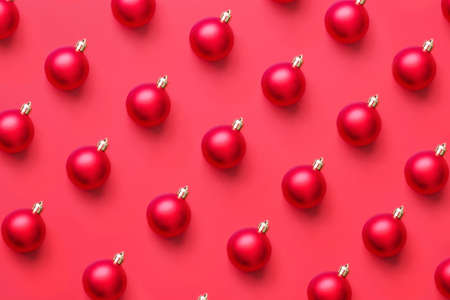 Christmas ball bauble pattern minimal flatlay on red background top view