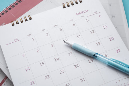 calendar page with pen close up background business planning appointment meeting concept
