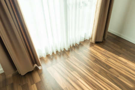 Curtain window interior decoration in living room on sunny day with sunlightの写真素材