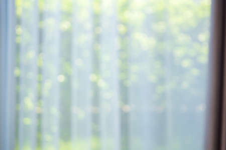 Abstract blur curtain window with green garden backgroundの写真素材