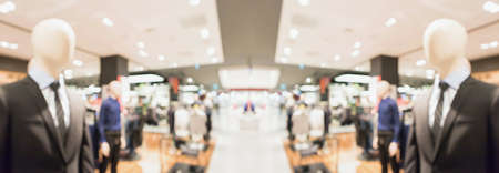Abstract blur clothing boutique display interior of shopping mall background