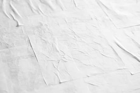 Blank white crumpled and creased paper poster textureの写真素材
