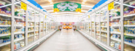 supermarket grocery store aisle and shelves blurred backgroundの写真素材