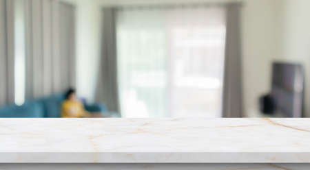 Empty marble table top with blur room interior with window curtain background