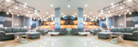 Abstract blur furniture department store showroom interior with bokeh light background