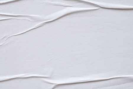 white crumpled and creased paper poster texture background