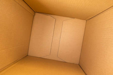 Open empty brown cardboard box background top view