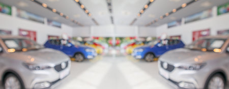 new cars in showroom interior blurred abstract backgroundの写真素材