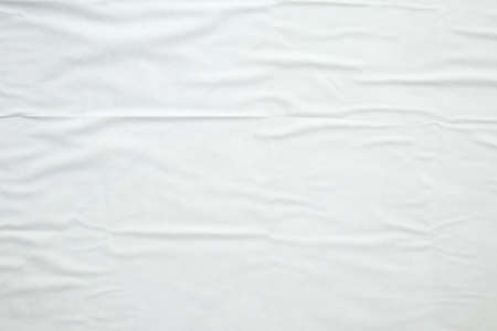 white crumpled and creased paper poster texture backgroundの写真素材