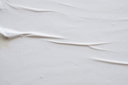 white crumpled and creased paper poster texture backgroundの写真素材