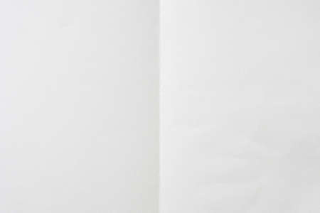 White folded and wrinkled paper texture background