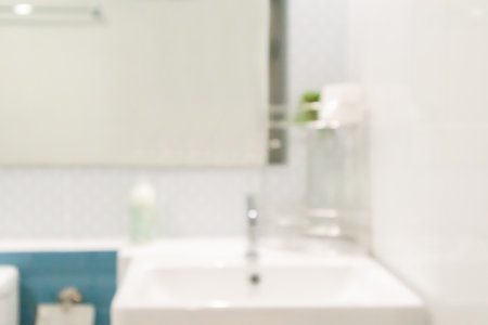 Abstract blur white sink and faucet bathroom interior backgroundの写真素材